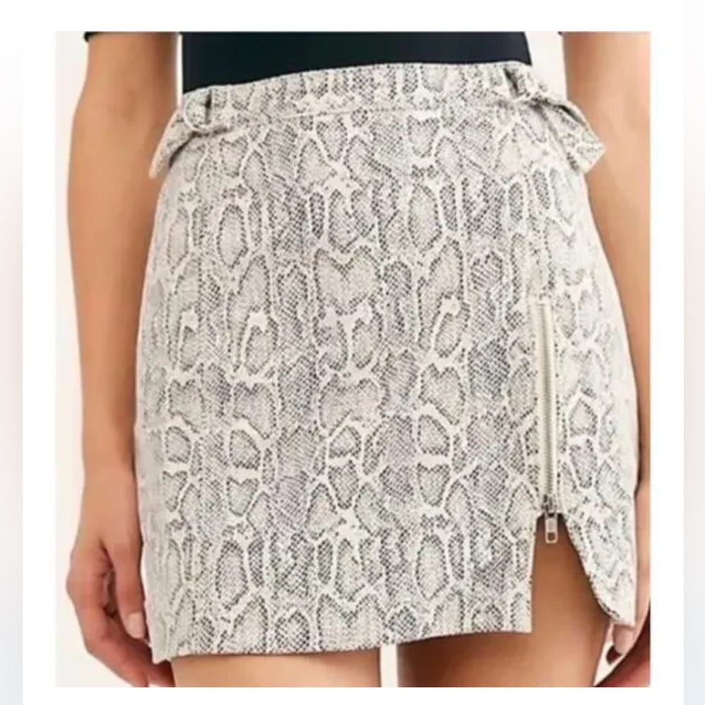 Free People snake skin mini skirt with adjustable sides.